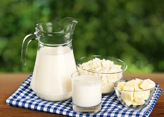 Milk, yogurt, cheese, butter on light table, variety of dairy products
