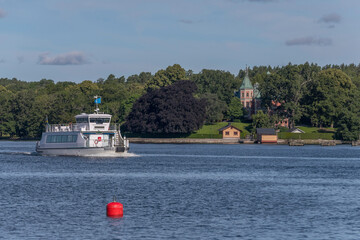 Harbor commuter ferry at the foreland Blockhusudden a sunny summer morning in Stockholm