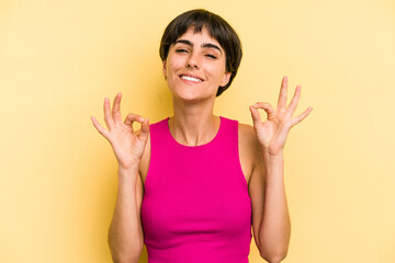 Young caucasian woman with a short hair cut isolated cheerful and confident showing ok gesture.