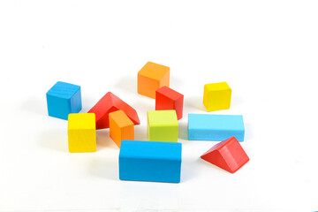 Fototapeta na wymiar Different colorful shapes of wooden blocks on white background. Geometric shapes in different colors,