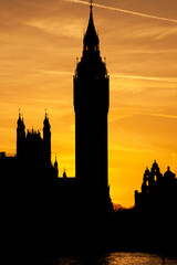 Big ben clock tower silhouette at sunset in London, England