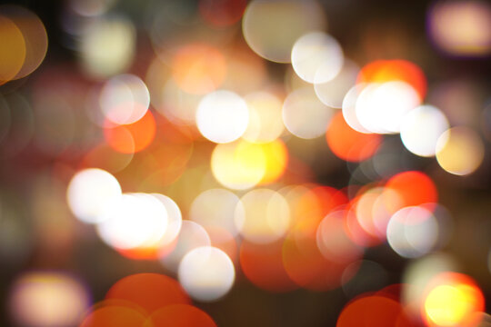  an X-patterned bokeh with red color photo of a city at night    