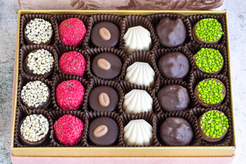 Special chocolate. Packed chocolate on stone background. Truffle chocolate varieties. close up
