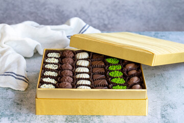 Special chocolate. Packed chocolate on stone background. Truffle chocolate varieties. close up