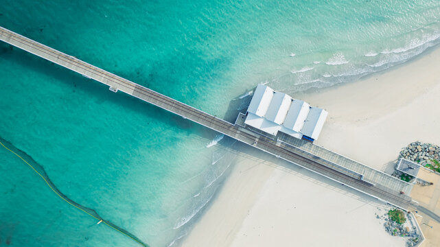 Aerial bird eye view of turquoise water and Busselton Jetty, Western Australia