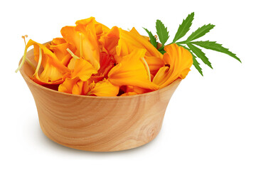 petals of fresh marigold or tagetes erecta flower in wooden bowl isolated on white background with full depth of field.