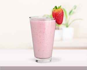Tasty iced pink milk. Cold sweet drink mix with milk and ice in glass