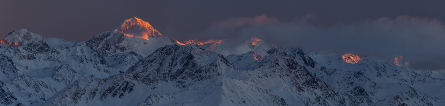 Colorful sunset panorama of Alps at winter