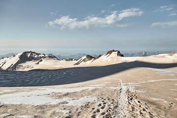 Climbing Kazbek, Georgia. trail to the summit.  Nature of Caucasian mountains. Mount Kazbek...