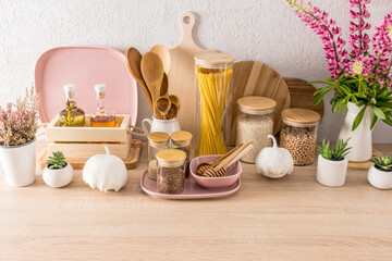 fashionable food storage area in the kitchen on a modern countertop. cutting boards, cans, containers. eco-friendly materials. without plastic.