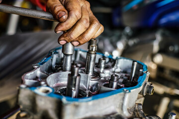 Fototapeta na wymiar Maintenance and fix repair gear engine hand of technician close up
