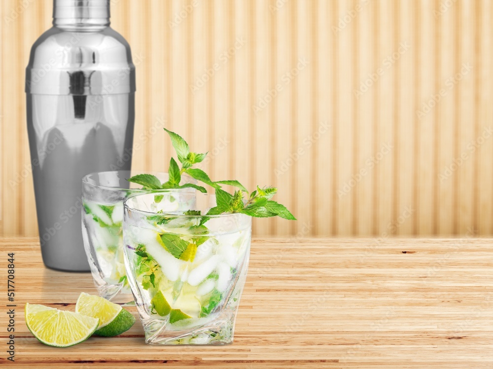 Canvas Prints Mojito cocktail or mocktail with lime, mint, and ice in a glass. Summer cold alcoholic non-alcoholic drink, beverage and cocktail recipe. Bar menu.