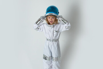 Kid boy exploring space. Portrait of cute kids in space suits. Cosmonautics day concept. Success, creative and kids start up.