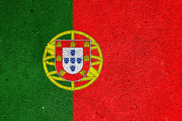 Fototapeta premium Flag of the Republic of Portugal on cement plaster
