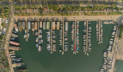 Aerial view of a harbor full of fishing boats and sailboats at the coast of Mersin, Turkey