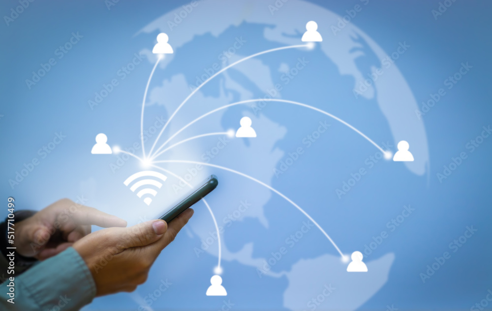 Poster close-up of a business man's hand using a smartphone wifi icon for network connection to access cust