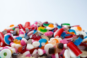 Tasty mix of jelly colorful candies isolated on a white background.