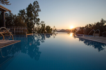 A swimming pool in a calm sunset. A good example of a beautiful holiday