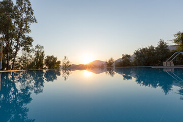 A swimming pool in a calm sunset. A good example of a beautiful holiday