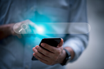 search technology Search Engine Optimization A man uses his smart phone to search for information. by using the search engine bar functionality on your website.