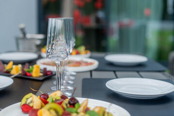 a set table in a restaurant in nature. photo of glasses