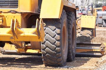 Heavy construction machines outdoors for public place reconstruction.