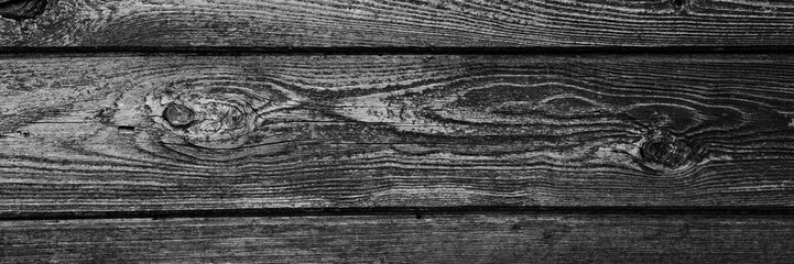 Obraz premium the background is tinted in black and grey colour of old wooden boards. mockup. banner