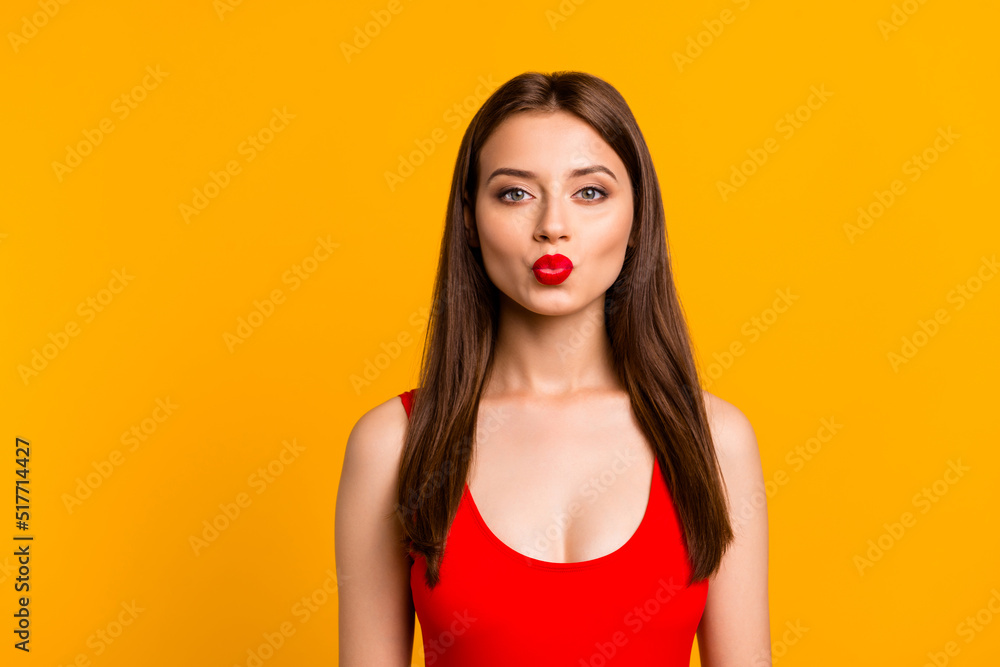 Sticker Portrait of adorable girl kiss pouted lips wear bright swim suit isolated on yellow color background