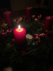 Christmas wreath with one burning candle - Adventskranz mit einer brennenden Kerze