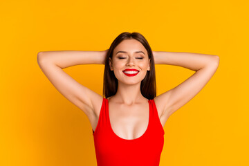 Photo of dreamy cute lady dressed bodysuit closed eyes arms behind head isolated yellow color background