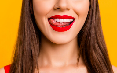 Close up cropped photo of gorgeous person tongue lick teeth beaming smile isolated on yellow color background