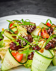delicious fresh beef salad on a black background