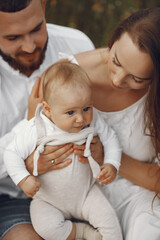 Family spend time in a summer field