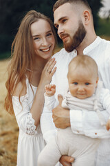 Family spend time in a summer field