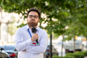 journalist smart professional brunette journalist reporting news on television irritated