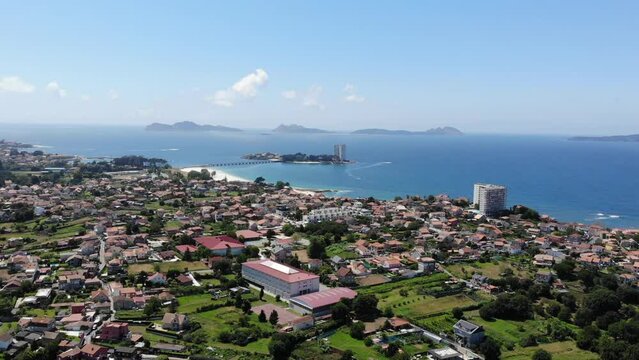 Float over the city of Vigo, Galicia, Spain as we fly toward the colorful coastal islands of Isla de Toralla and Islas C&iacute;es.  We leave the city behind now and journey to an island paradise.