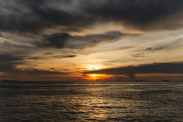 Naklejka na ściany i meble Beautiful natural sunset scene over the ocean.