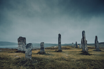 Selective focus on front stone. Ancient magic in the Calanais Standing Stones Circle, erected by...