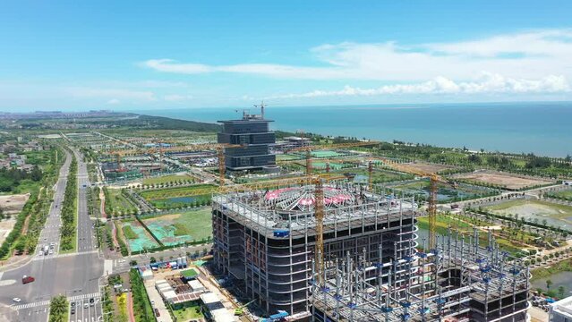 Aerial Video of Haikou City Jiangdong New District, an International Hub for Retail, Residential, Leisure, Workplace, and Transportation in Hainan Free Trade Zone, Hainan Province, China, Asia.