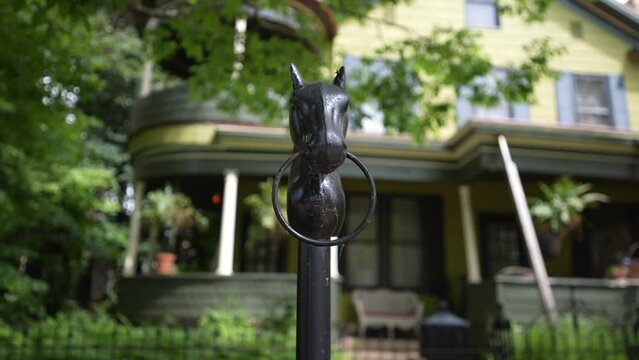 Closeup of horse hitching ring on post in front of mansions in Julia Ann Historic district downtown neighborhood in Parkersburg, WV.