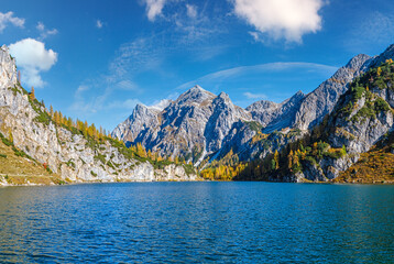 Fototapeta premium Sunny autumn alpine Tappenkarsee lake and rocky mountains above, Kleinarl, Land Salzburg, Austria.
