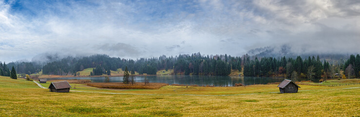 Alpine  lake Geroldsee or Wagenbruchsee, Bavaria, Germany. Autumn overcast, foggy and drizzle day....