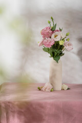 Pink lisianthus flowers on the pink tablecloth