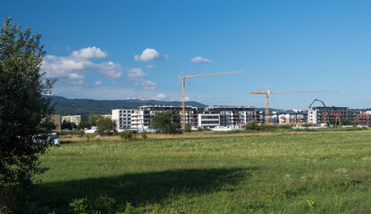 Fototapeta na wymiar Residential construction and crane at site work