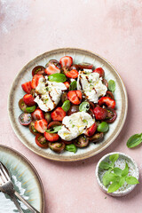 Salad with mozzarella, strawberries and cherry tomatoes
