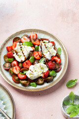 Salad with mozzarella, strawberries and cherry tomatoes