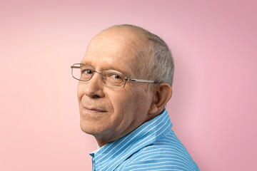 Nice old grey man posing on the color background