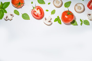 Mushrooms, tomato and basil isolated on white. Flatlay pattern on white background top view