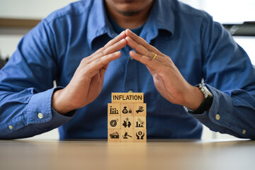 man with wooden blocks A company's recession solution or inflation business idea.