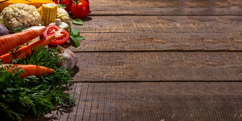 Autumn vegetables cooking background. Organic fall harvest farm vegetables, mushrooms. Various vegetarian ingredients set for cooking dinner on wooden kitchen background, top view copy space © ricka_kinamoto